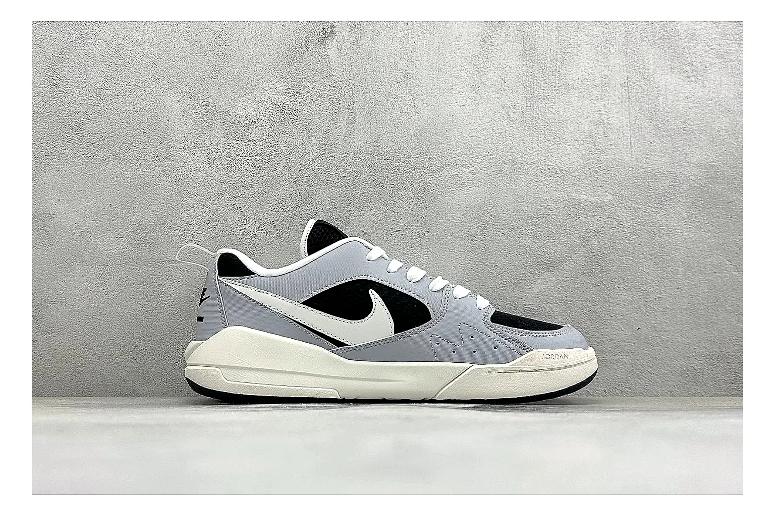 Jordan CMFT Black White spreadsheet record photo showing black and white layered panels, low padded collar, visible Jordan styling cues, and a compact court sole thumbnail 6
