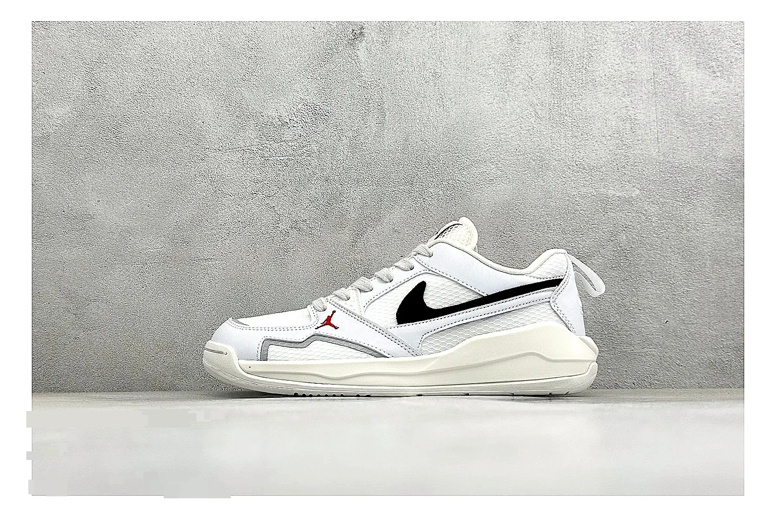 Jordan CMFT White Black spreadsheet record photo showing white and black layered court panels, red logo detail, low collar, and a clean contrast sole