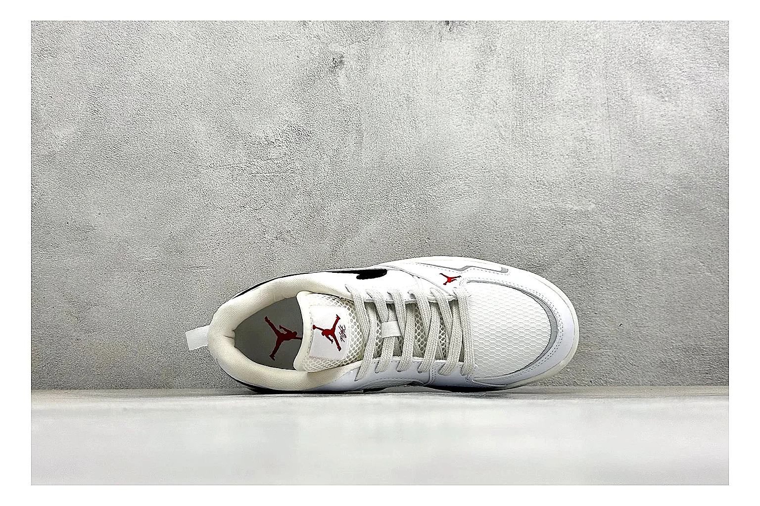 Jordan CMFT White Black spreadsheet record photo showing white and black layered court panels, red logo detail, low collar, and a clean contrast sole thumbnail 2