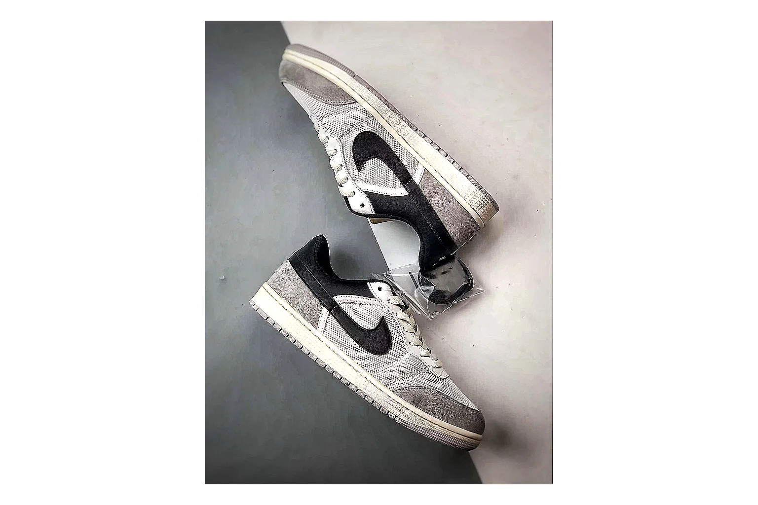 Jordan Low Black White Sneaker Sheetbase record image with white black low-top sneaker with mixed-material upper and low-profile shape