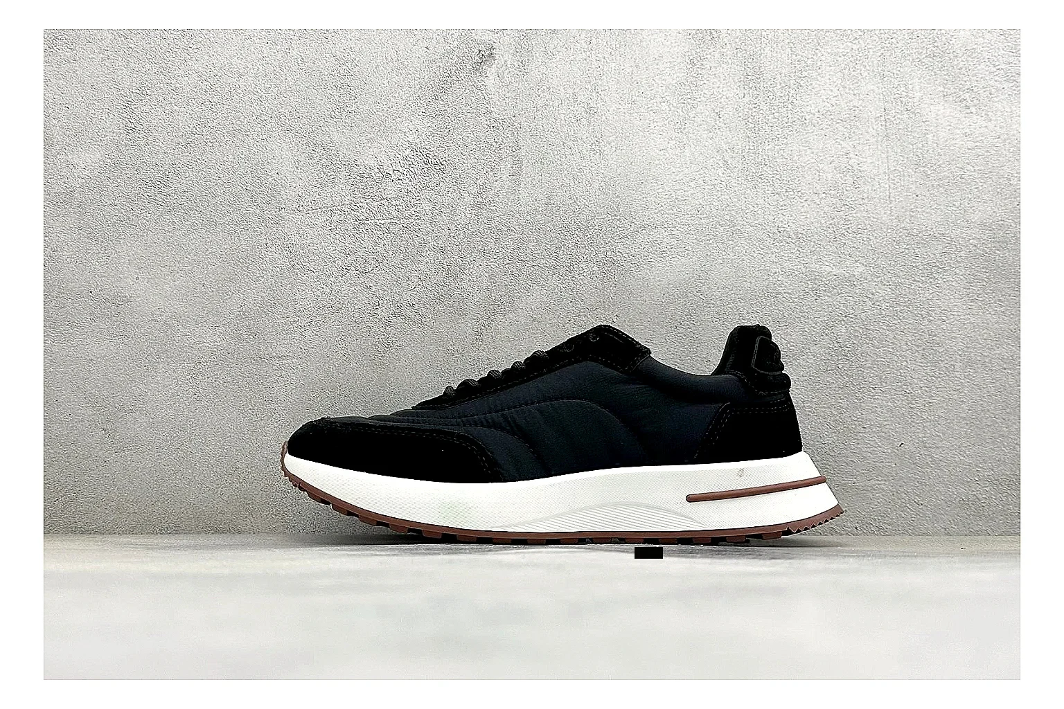 Loro Piana Week-End Black spreadsheet record image showing black suede upper, low casual profile, striped midsole accent, and soft everyday shape
