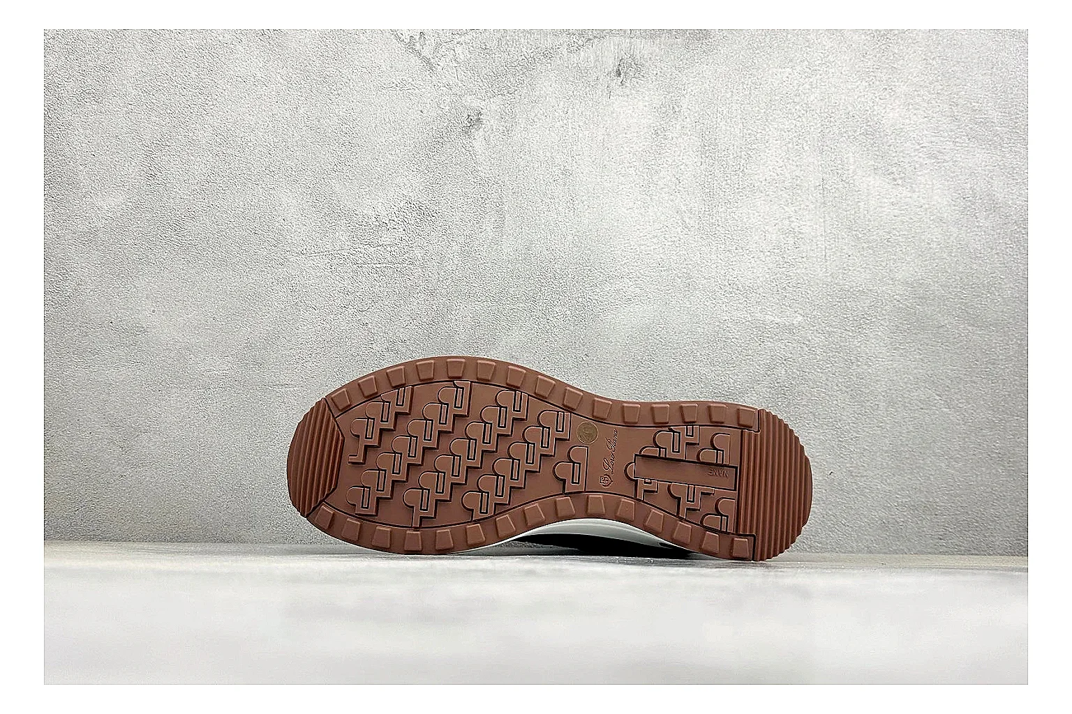 Loro Piana Week-End Black spreadsheet record image showing black suede upper, low casual profile, striped midsole accent, and soft everyday shape