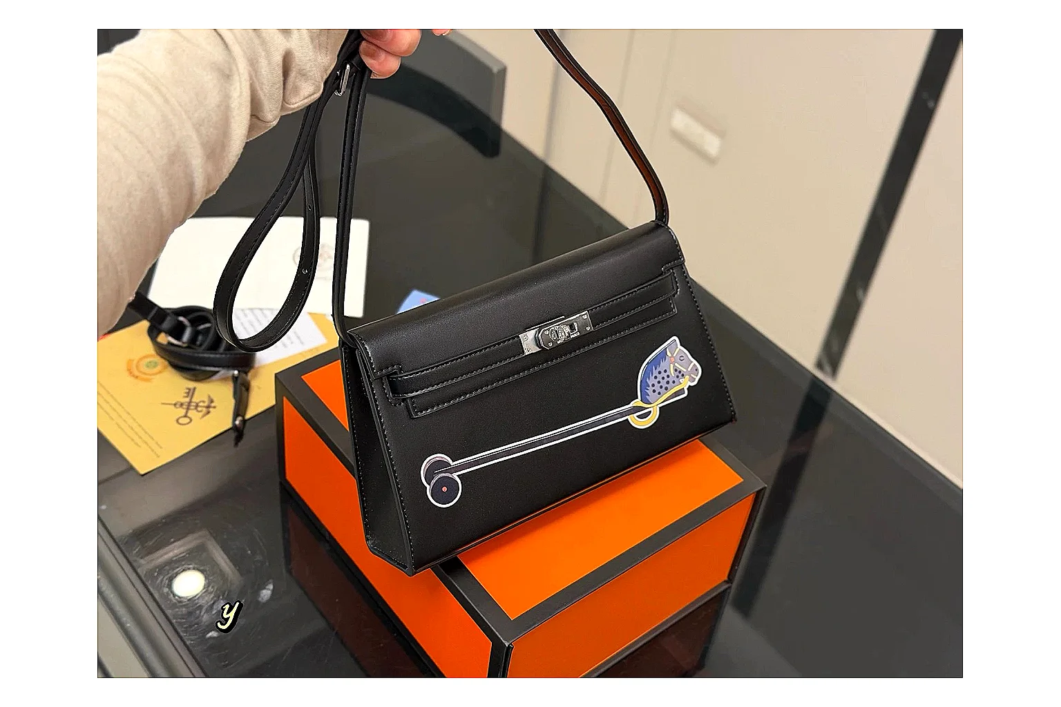 Louis Vuitton Wallet On Chain Black spreadsheet record photo showing black leather wallet-bag body, compact flap shape, chain strap, and polished LV-style hardware thumbnail 6