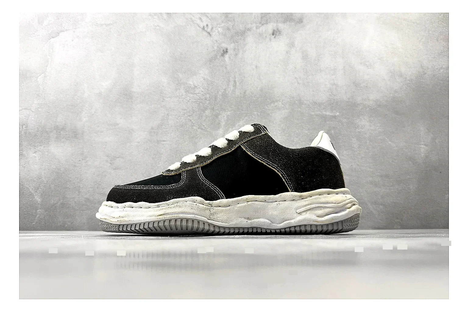 Maison Mihara Yasuhiro Blakey Black Distressed spreadsheet record photo showing black distressed canvas upper, warped sculpted white sole, low lace profile, and worn texture