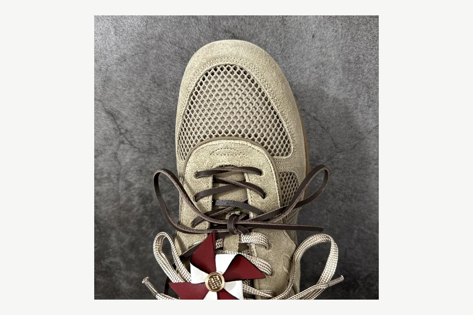 Miu Miu Beige Logo Sneaker Sheetbase record image with beige logo low-top with mixed-material upper and low-profile shape