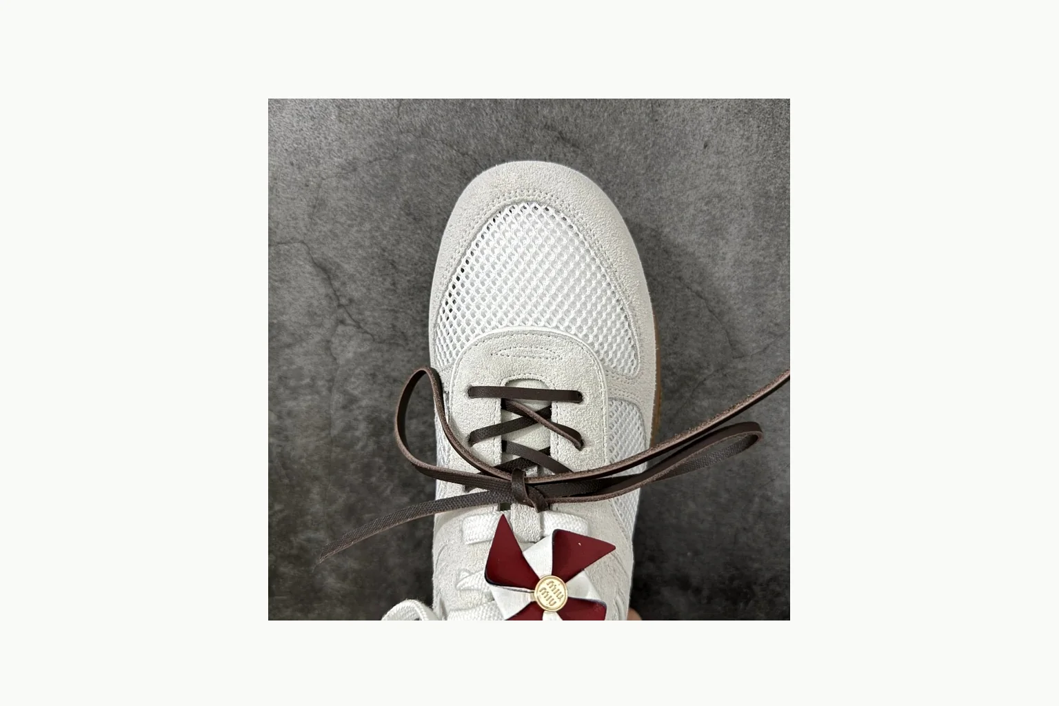Miu Miu White Bow Sneaker Sheetbase record image with white bow-detail low-top with mixed-material upper and low-profile shape