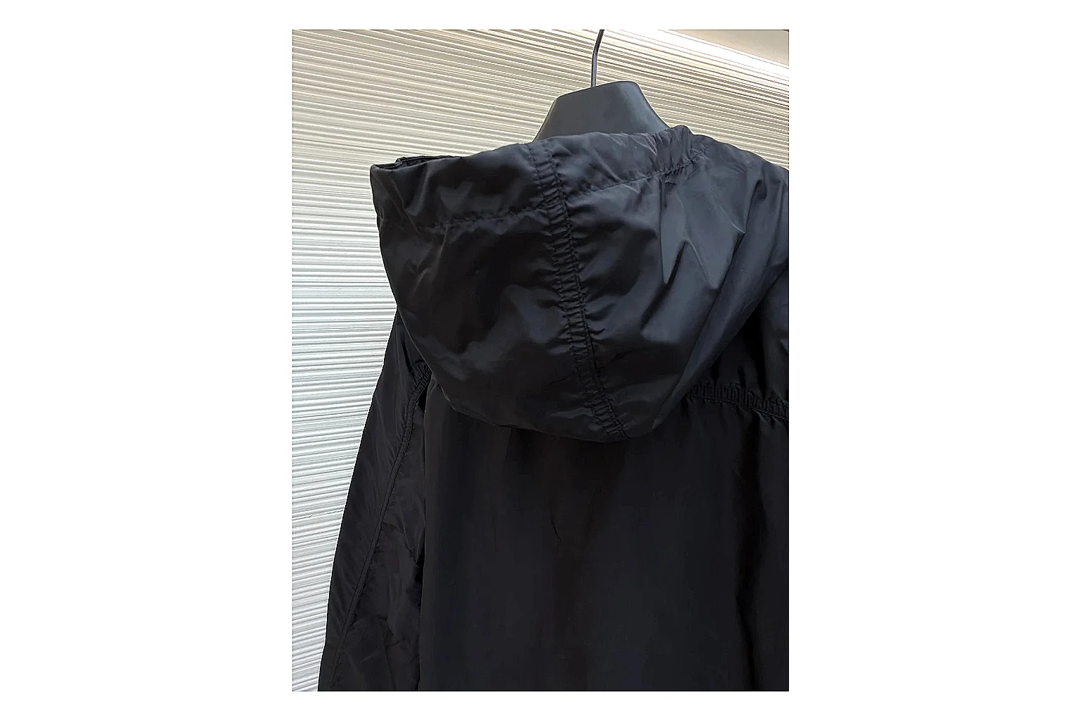 Moncler Nylon Hooded Jacket Black Jacket spreadsheet record image with black nylon hooded jacket with nylon texture, hood structure, zipper line, sleeve cuffs, and light shell shape