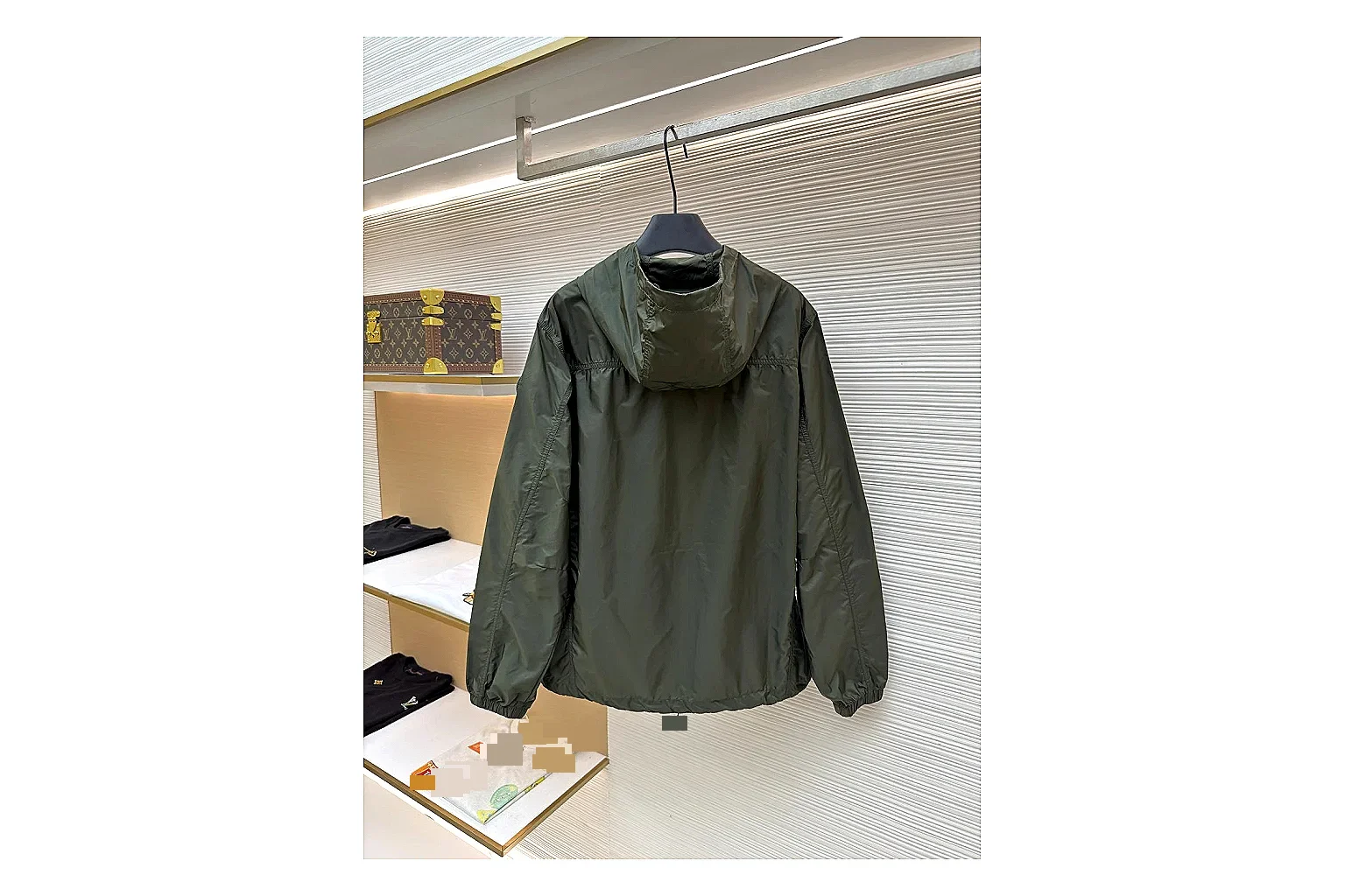 Moncler Nylon Hooded Jacket Olive Jacket spreadsheet record image with olive nylon hooded jacket with nylon texture, hood structure, zipper line, sleeve cuffs, and light shell shape
