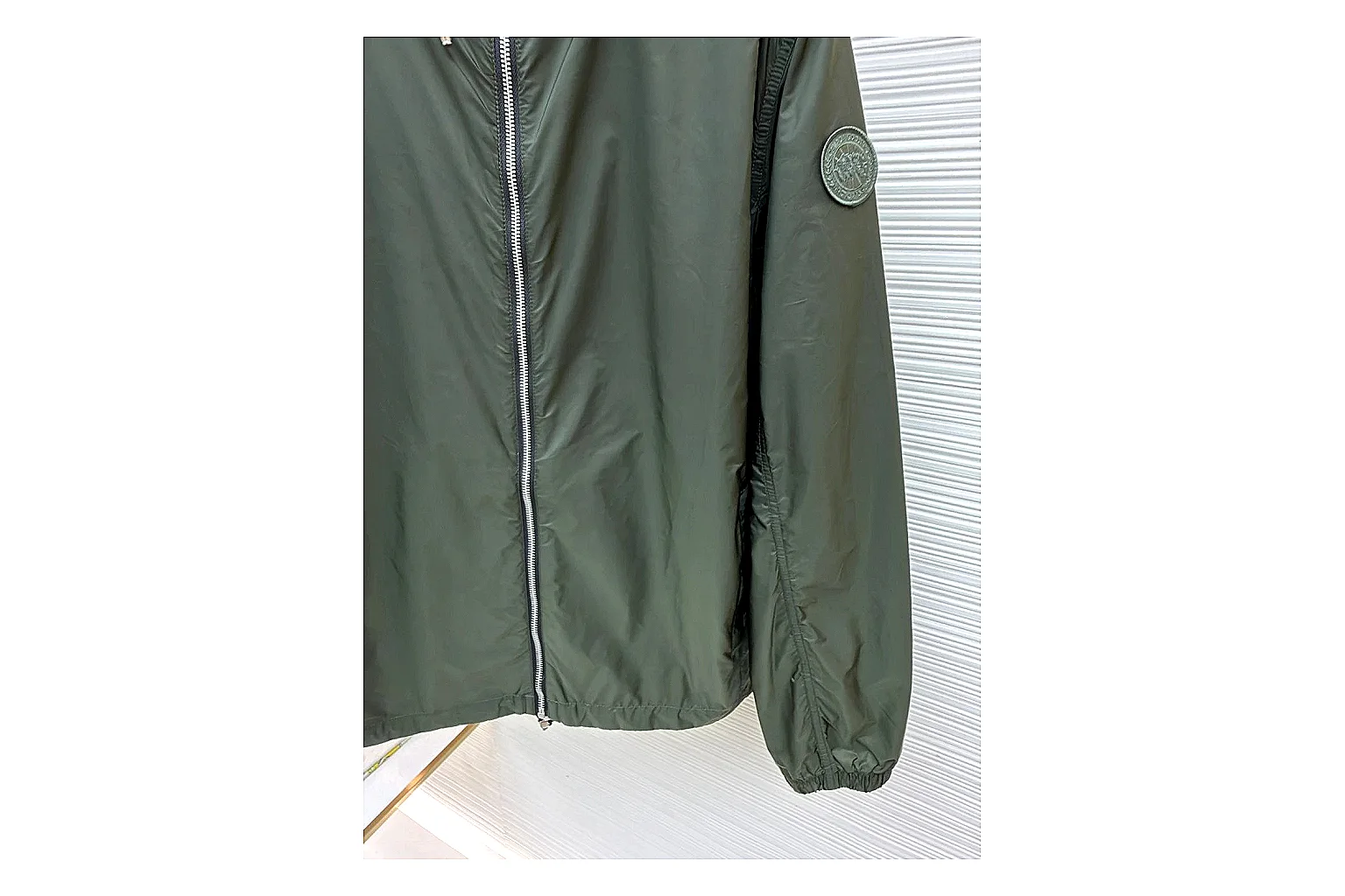 Moncler Nylon Hooded Jacket Olive Jacket spreadsheet record image with olive nylon hooded jacket with nylon texture, hood structure, zipper line, sleeve cuffs, and light shell shape thumbnail 2
