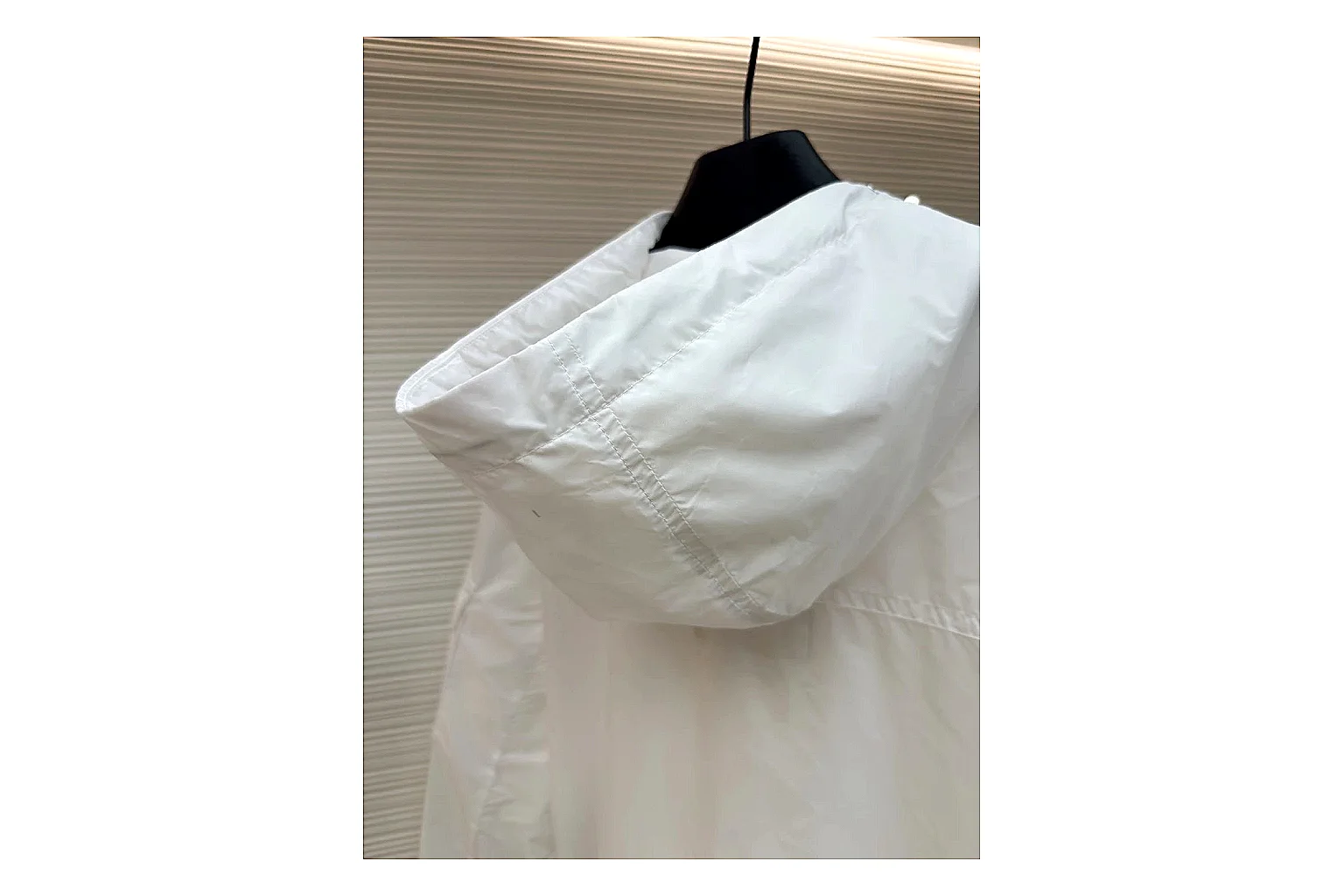 Moncler Nylon Hooded Jacket White Jacket spreadsheet record image with white nylon hooded jacket with nylon texture, hood structure, zipper line, sleeve cuffs, and light shell shape