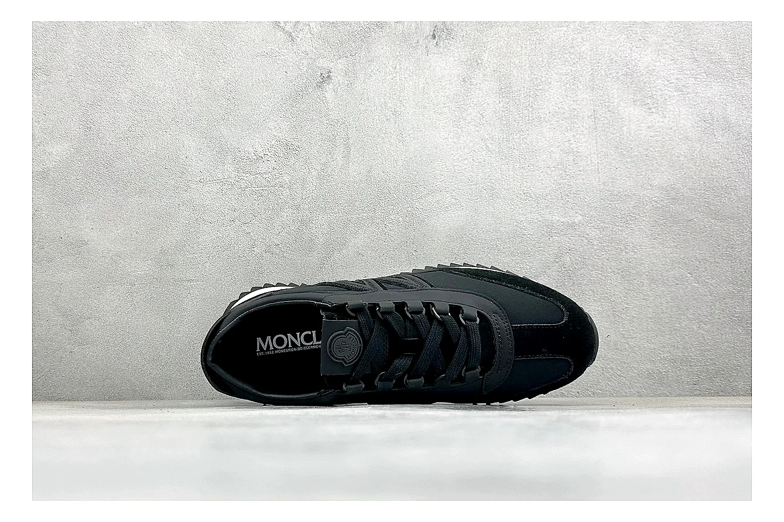 Moncler Pacey Black White spreadsheet record image showing black upper, white rugged outsole, low padded collar, and outdoor-leaning tread profile thumbnail 2