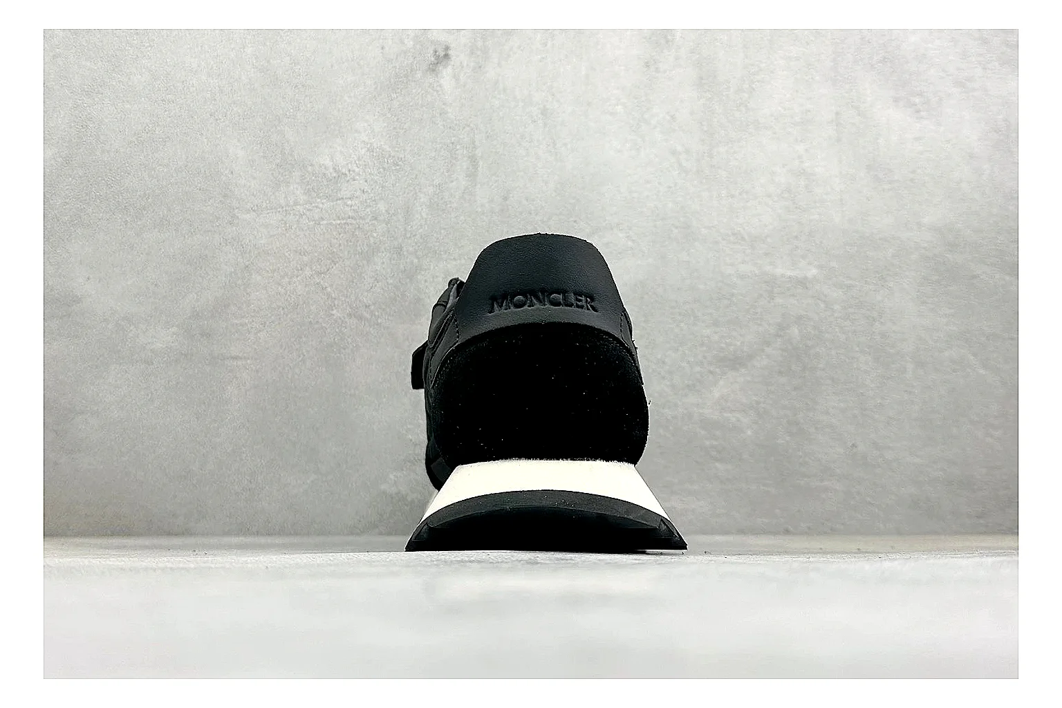 Moncler Pacey Black White spreadsheet record image showing black upper, white rugged outsole, low padded collar, and outdoor-leaning tread profile thumbnail 3