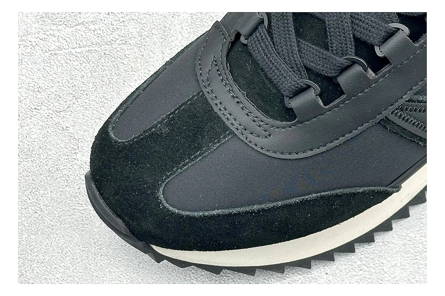 Moncler Pacey Black White spreadsheet record image showing black upper, white rugged outsole, low padded collar, and outdoor-leaning tread profile thumbnail 5