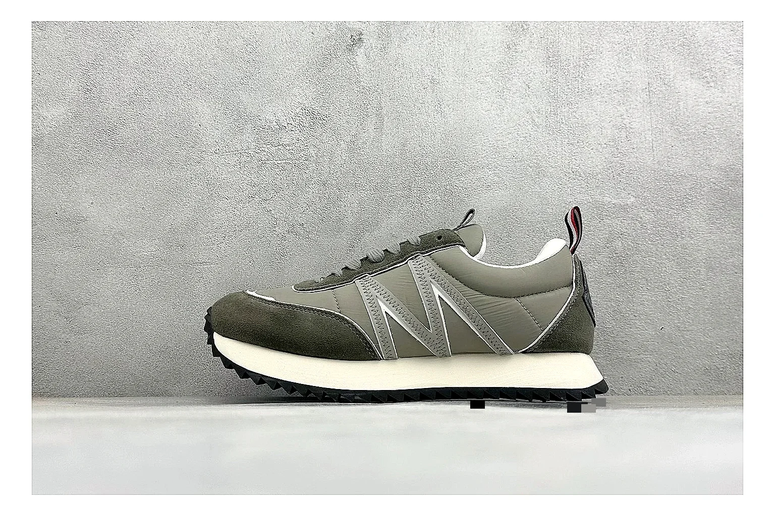 Moncler Pacey Grey Suede spreadsheet record image showing grey suede upper, rugged white outsole, low collar, and soft neutral streetwear tone
