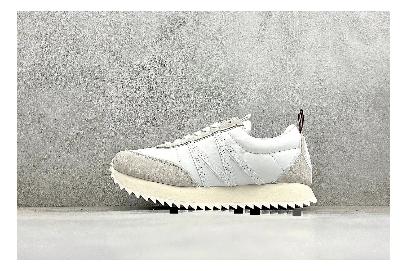 Moncler Pacey White Suede spreadsheet record image showing light suede upper, chunky serrated outsole, low padded collar, and tonal casual build
