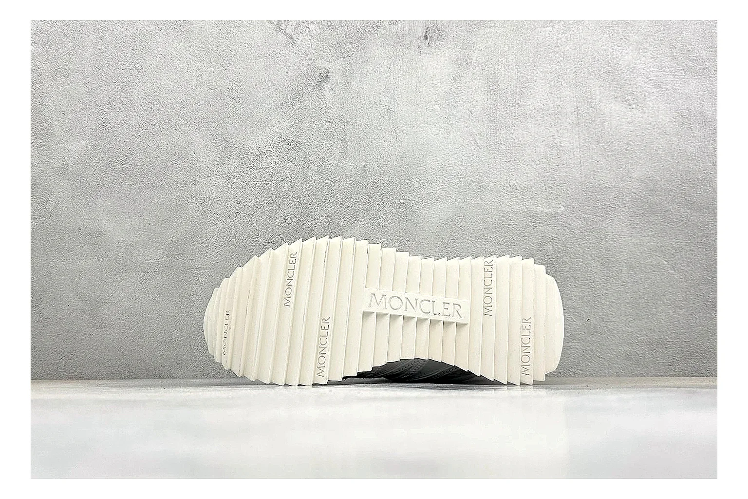 Moncler Pacey White Suede spreadsheet record image showing light suede upper, chunky serrated outsole, low padded collar, and tonal casual build