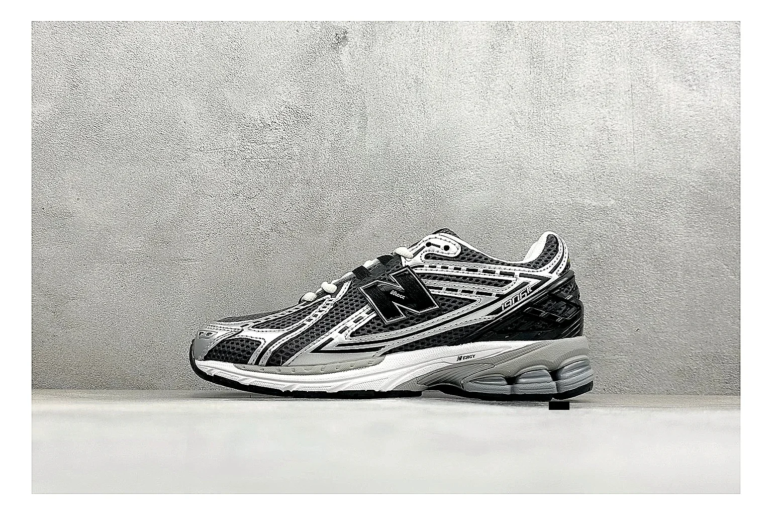 New Balance 1906 Black Silver spreadsheet record photo showing black mesh base, silver overlays, technical 1906 runner structure, and layered performance sole