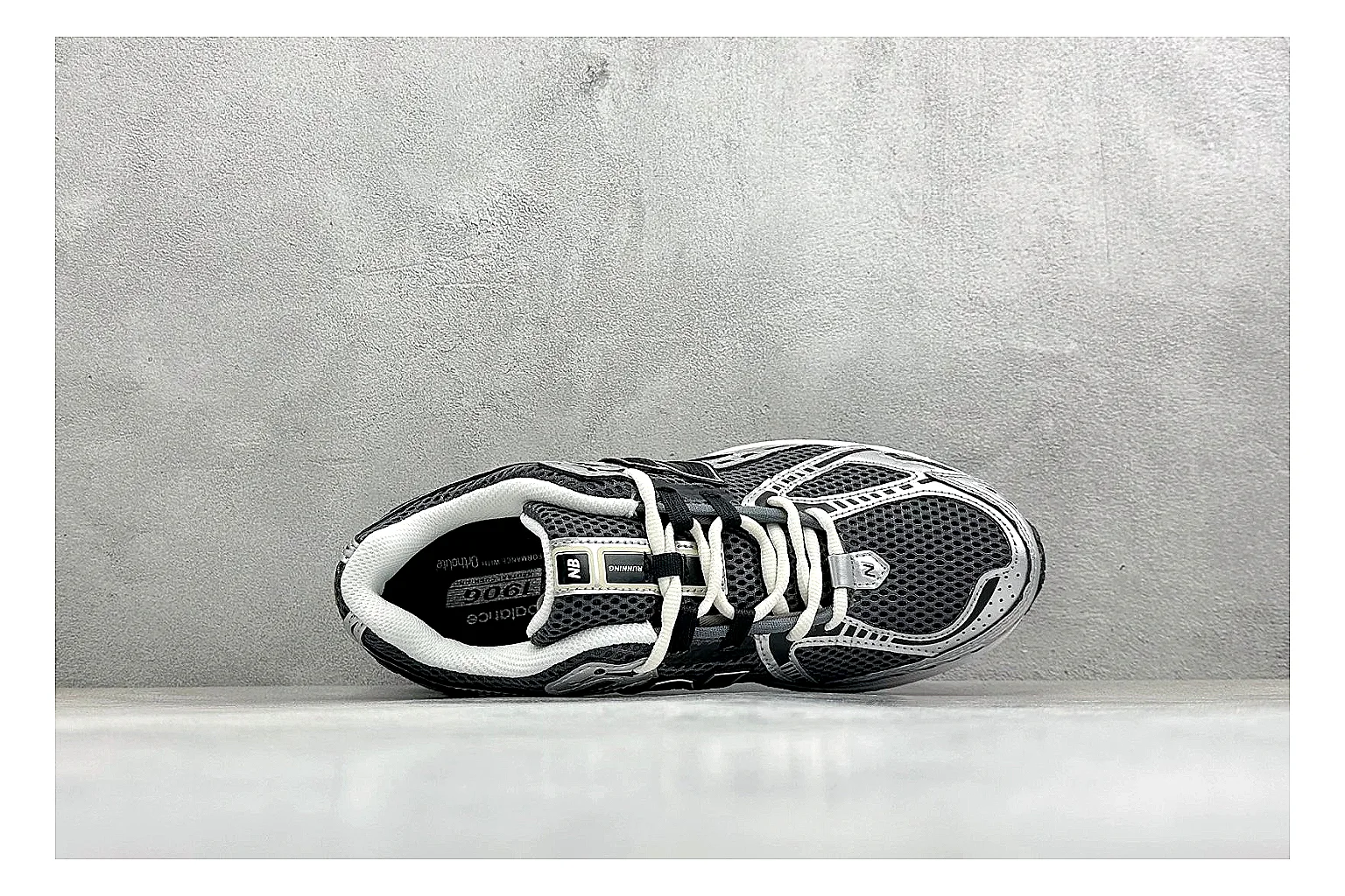 New Balance 1906 Black Silver spreadsheet record photo showing black mesh base, silver overlays, technical 1906 runner structure, and layered performance sole thumbnail 2