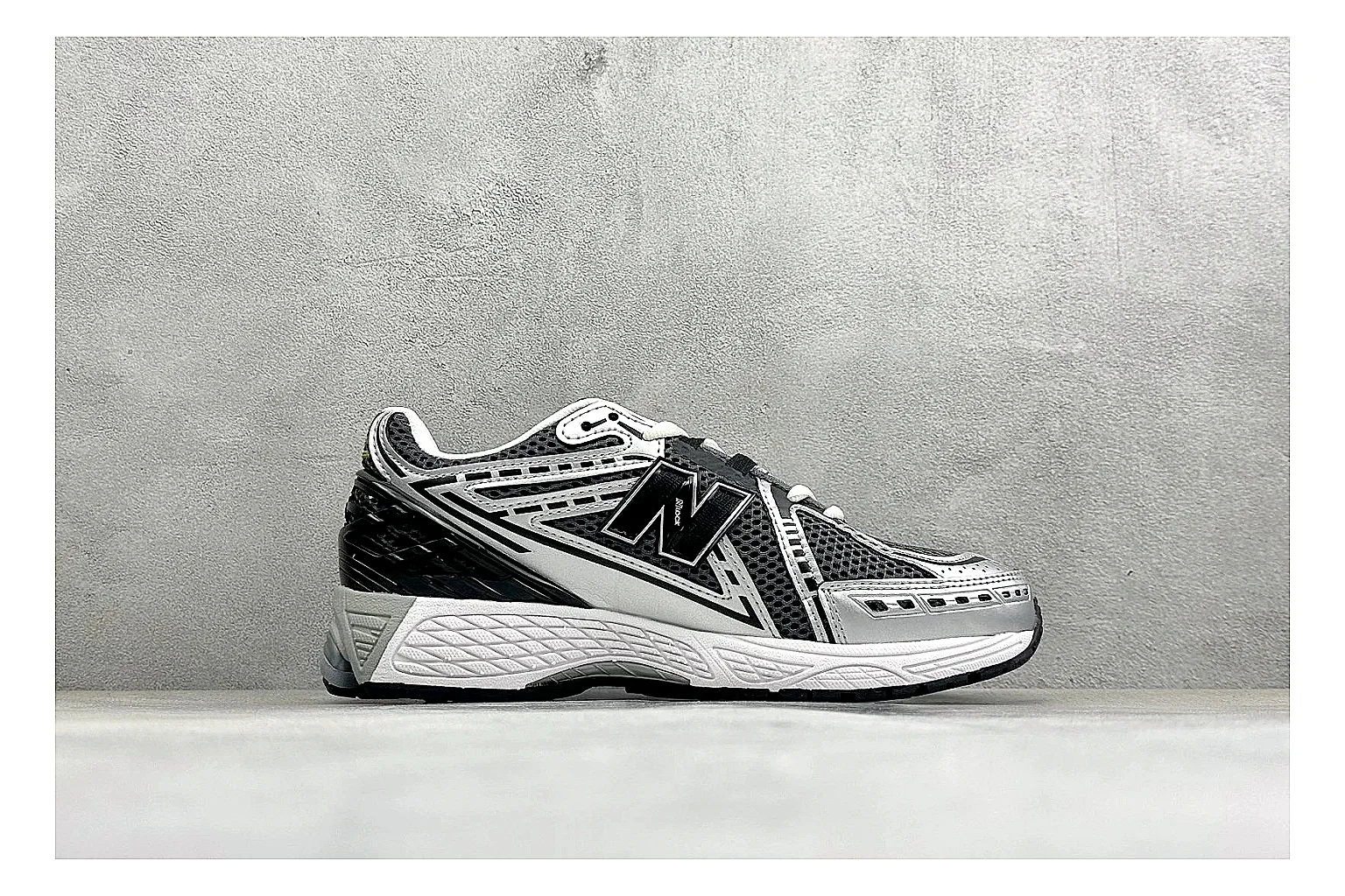 New Balance 1906 Black Silver spreadsheet record photo showing black mesh base, silver overlays, technical 1906 runner structure, and layered performance sole thumbnail 6
