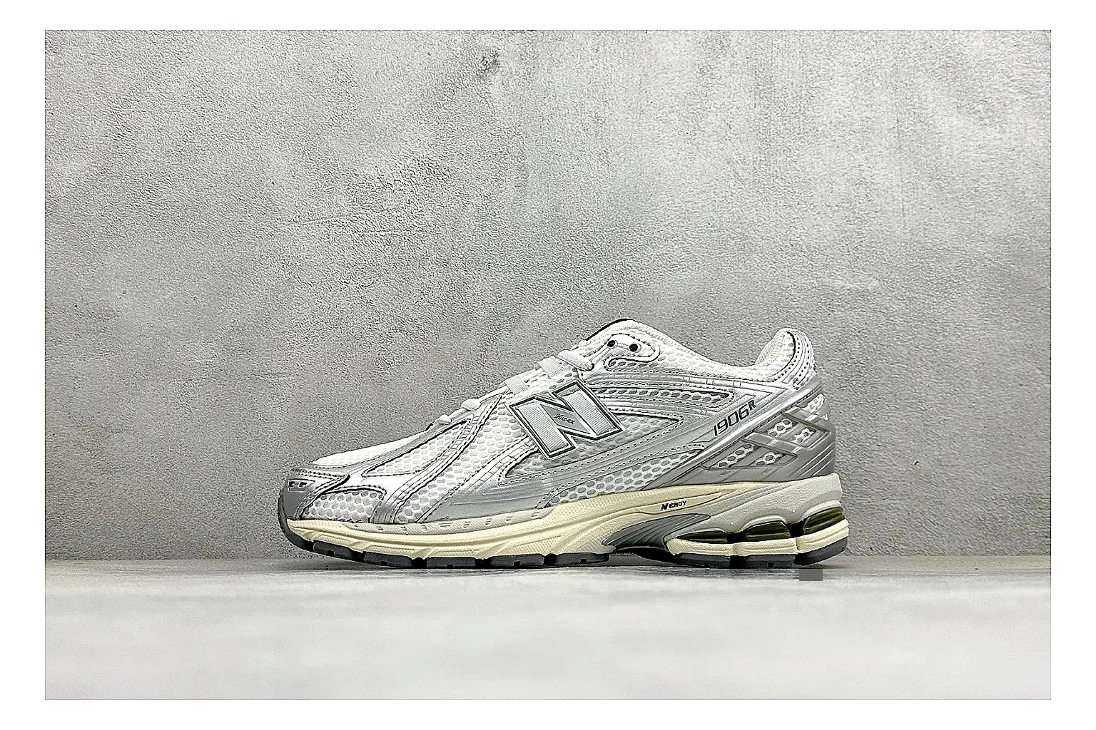 New Balance 1906 Silver Grey spreadsheet record image showing silver overlays, grey mesh panels, technical runner structure, and layered midsole tooling