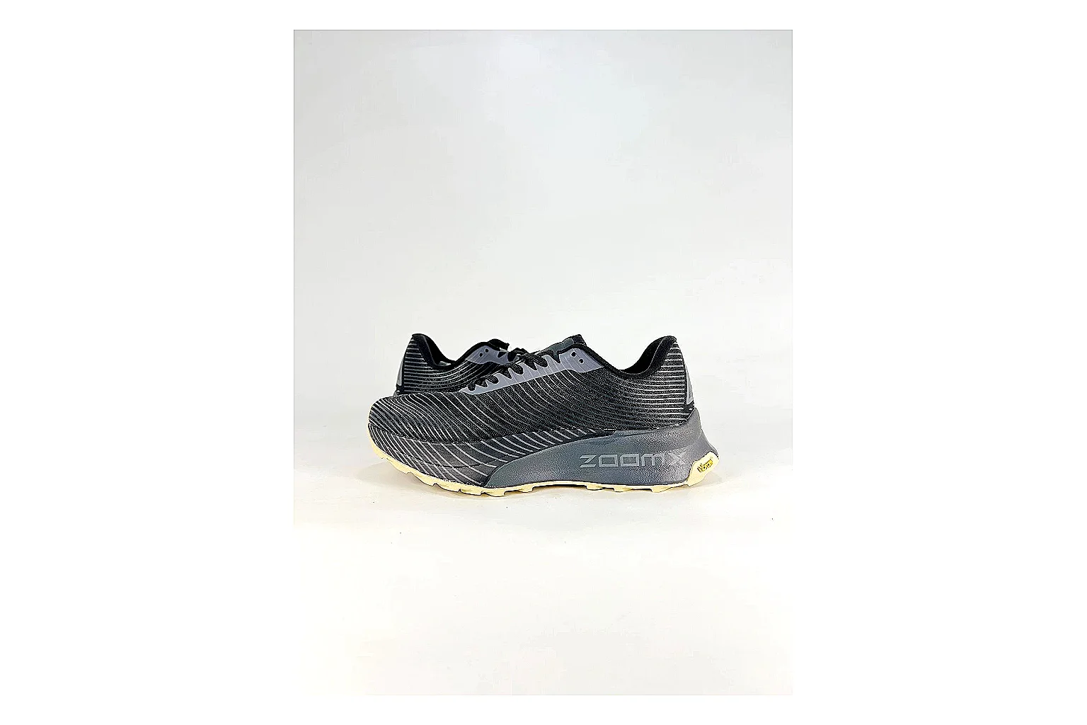 Nike ACG Ultra Black Gum Sneakers spreadsheet record image with black gum outdoor sneakers with textile texture, side-profile shape, upper panel lines, and outsole detail