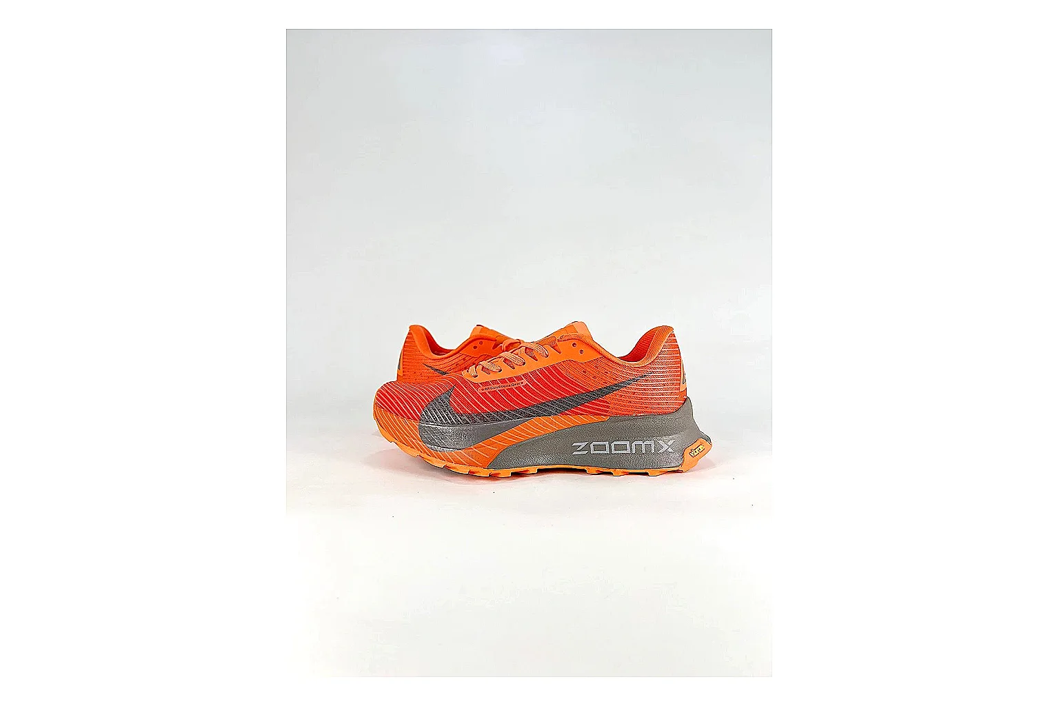 Nike ACG Ultra Orange Gray Sneakers spreadsheet record image with orange gray outdoor sneakers with textile texture, side-profile shape, upper panel lines, and outsole detail
