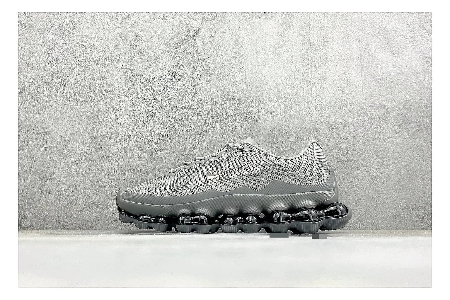 Nike Air Liquid Metal Silver spreadsheet record image showing reflective silver upper, running-inspired panels, sculpted pod outsole, and glossy tech finish