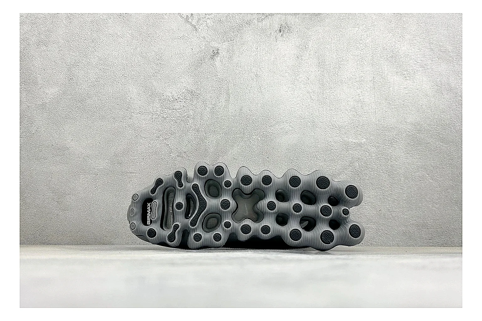 Nike Air Liquid Metal Silver spreadsheet record image showing reflective silver upper, running-inspired panels, sculpted pod outsole, and glossy tech finish
