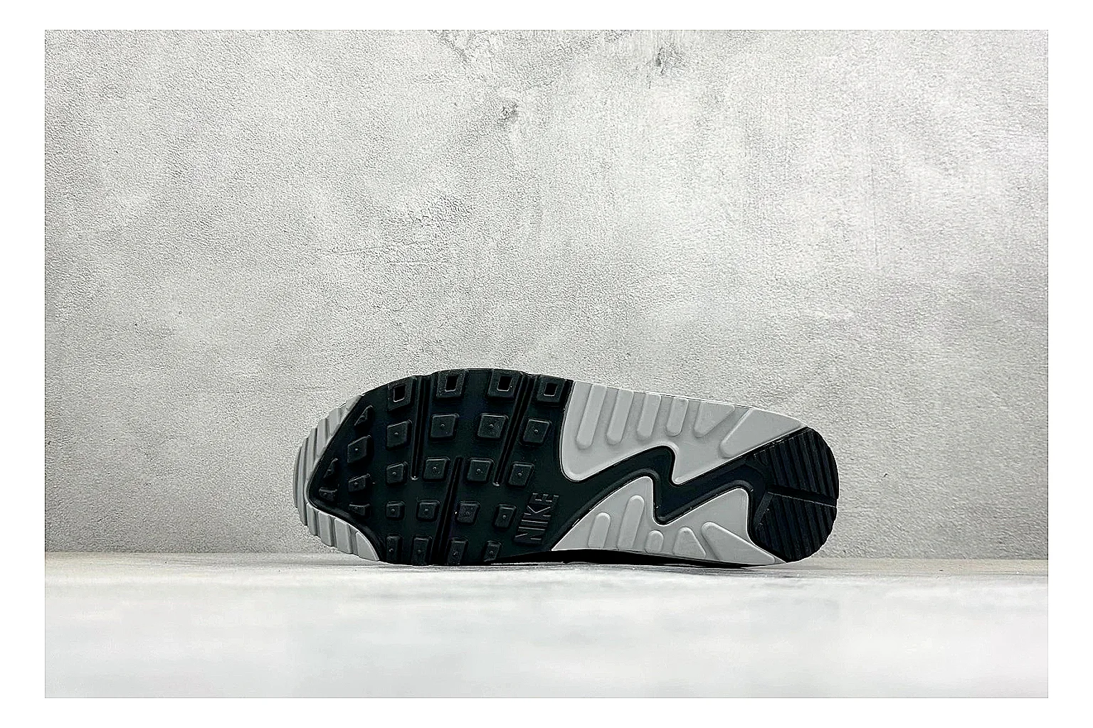 Nike Air Max 90 Grey Black spreadsheet record photo showing grey and black layered upper, visible Air window, classic Air Max 90 panels, and sturdy retro sole