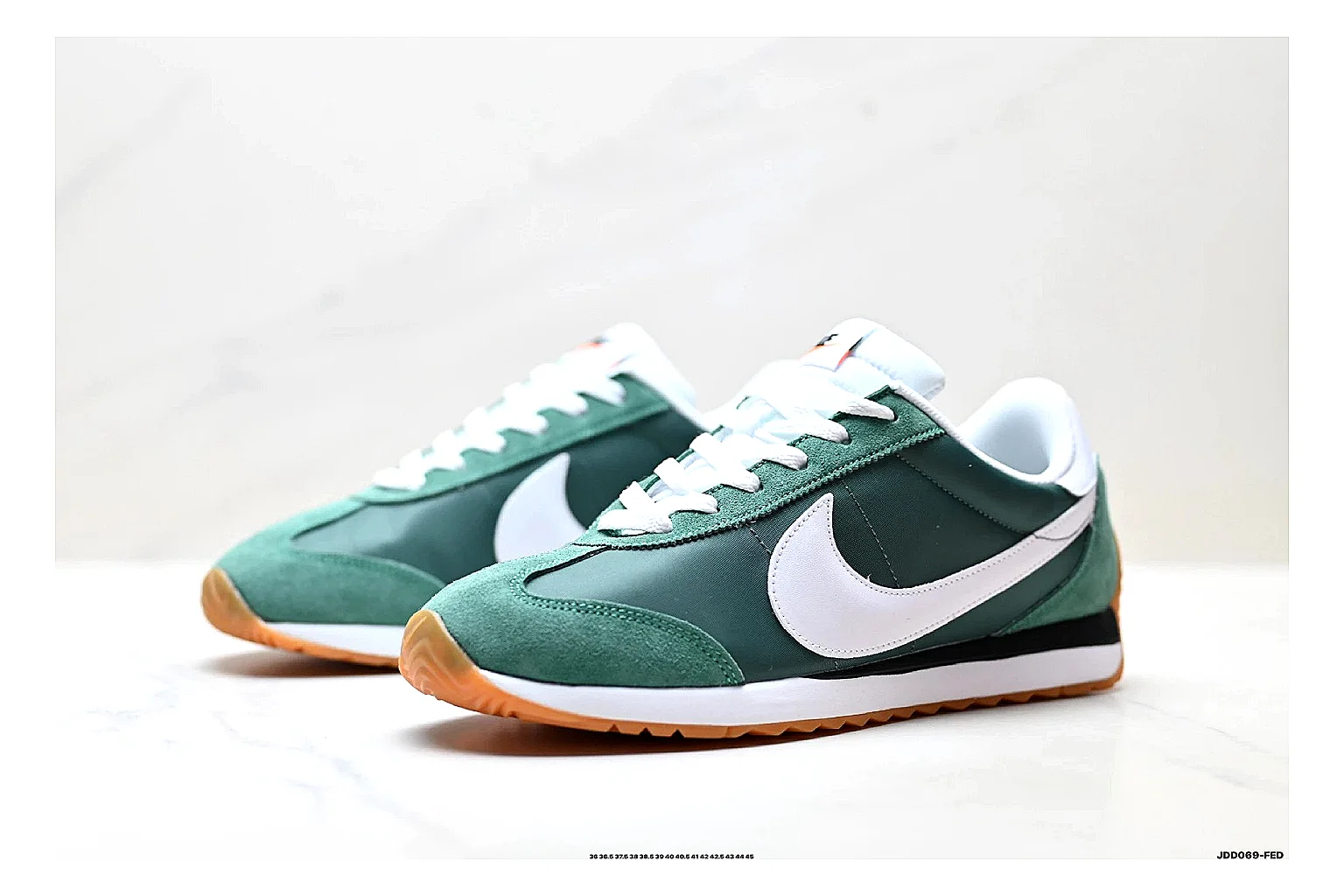 Nike Cortez Green White spreadsheet record photo showing green white leather low-top upper, slim retro runner profile, Swoosh detail, and classic Cortez sole