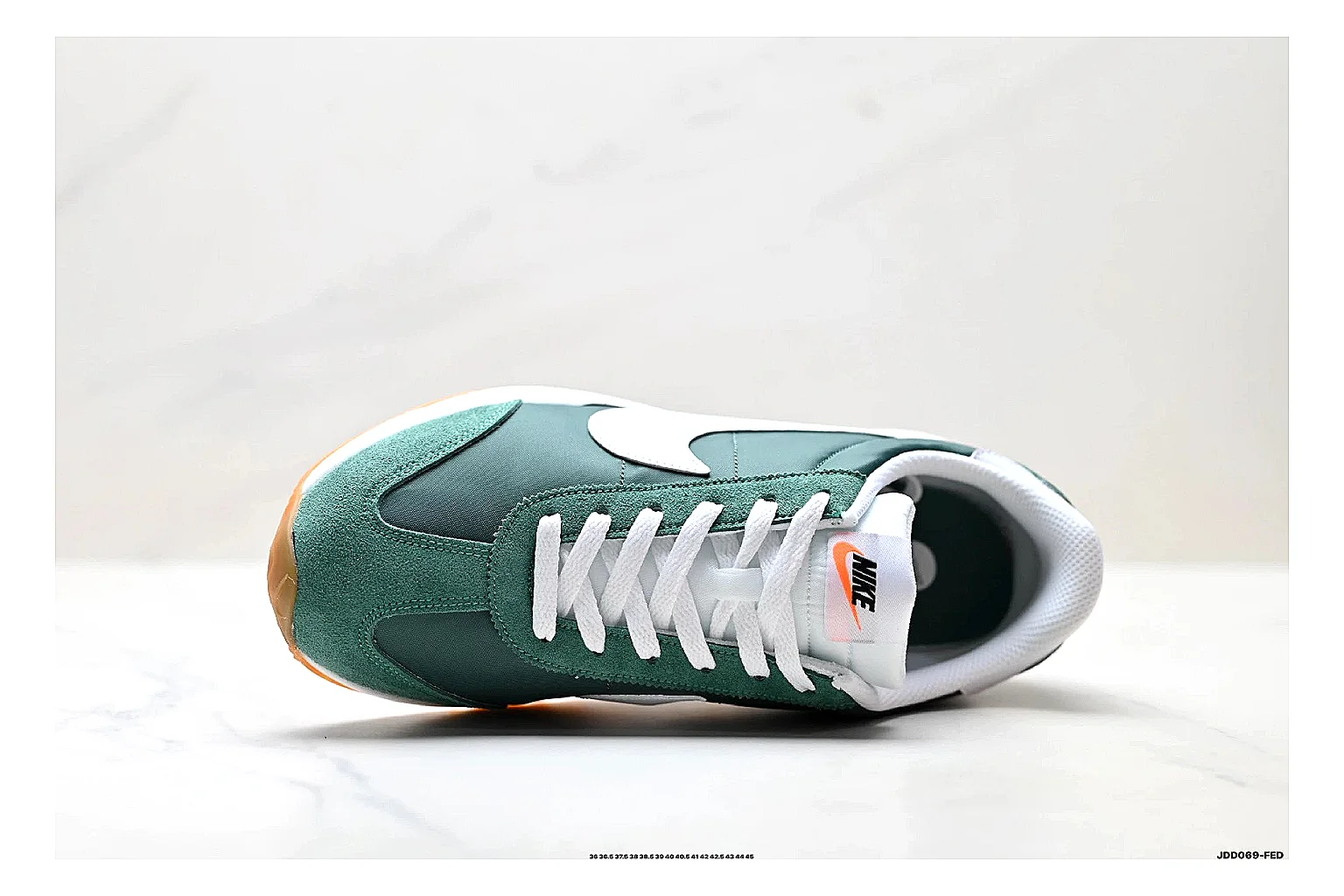 Nike Cortez Green White spreadsheet record photo showing green white leather low-top upper, slim retro runner profile, Swoosh detail, and classic Cortez sole thumbnail 6