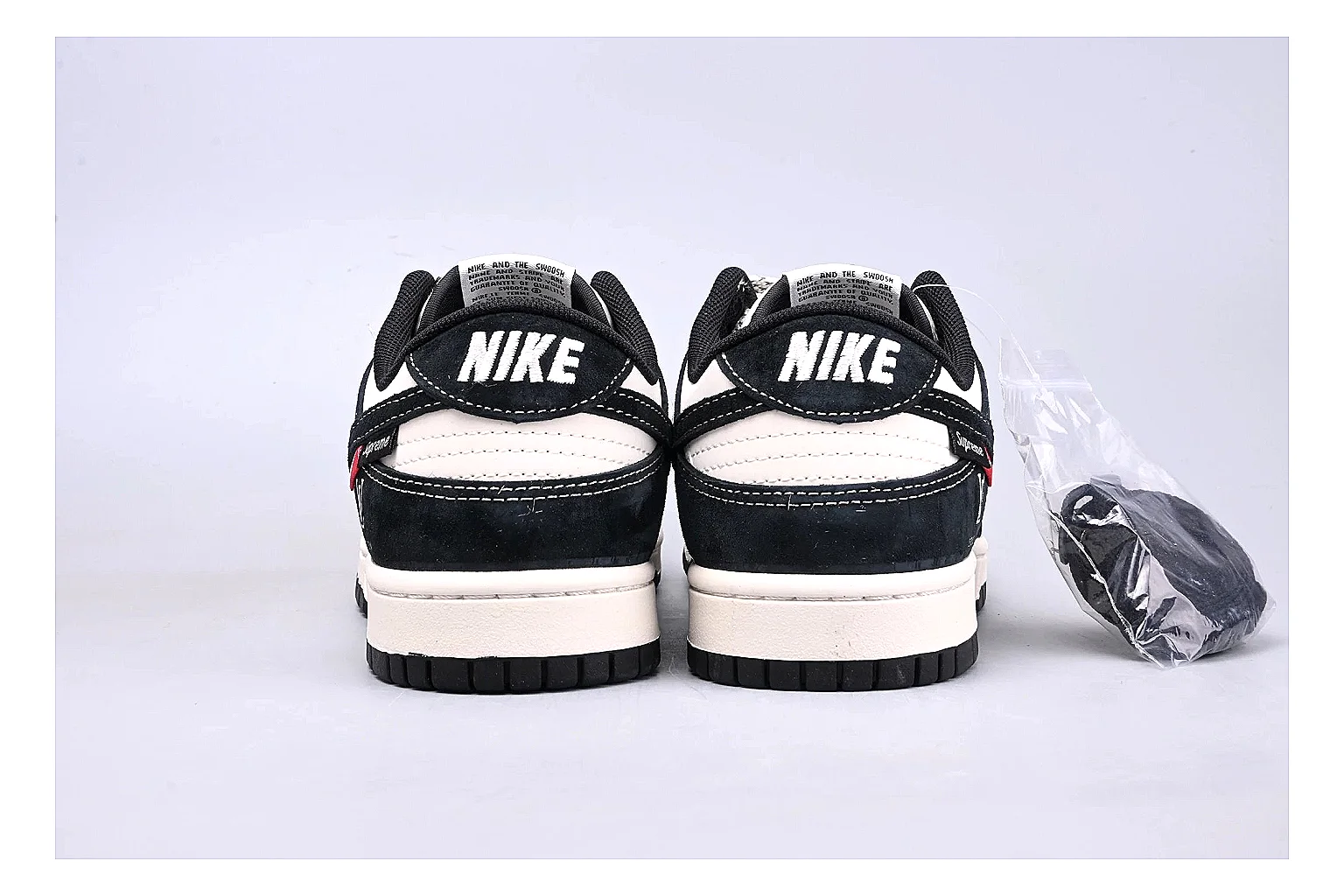 Nike Dunk Low Black White spreadsheet record photo showing black and white leather panels, low Dunk silhouette, padded collar, and basketball-retro sole