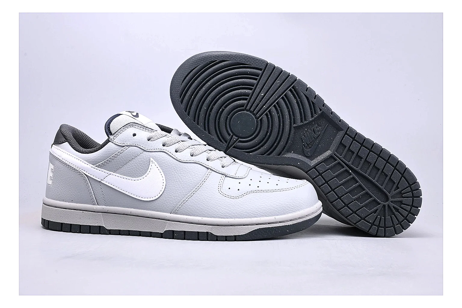 Nike Dunk Low White Gray spreadsheet record photo showing white and gray leather panels, low Dunk shape, padded collar, and basketball-retro sole thumbnail 3