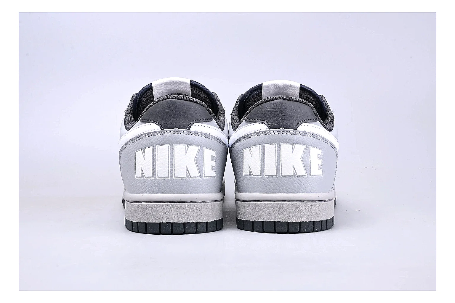 Nike Dunk Low White Gray spreadsheet record photo showing white and gray leather panels, low Dunk shape, padded collar, and basketball-retro sole