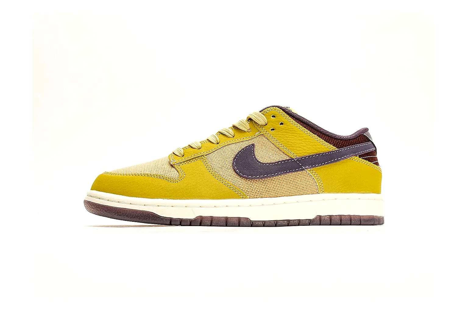 Nike Dunk Low Yellow Purple spreadsheet record photo showing yellow and purple leather panels, dark Swoosh, heel overlay, cream midsole, and brown outsole