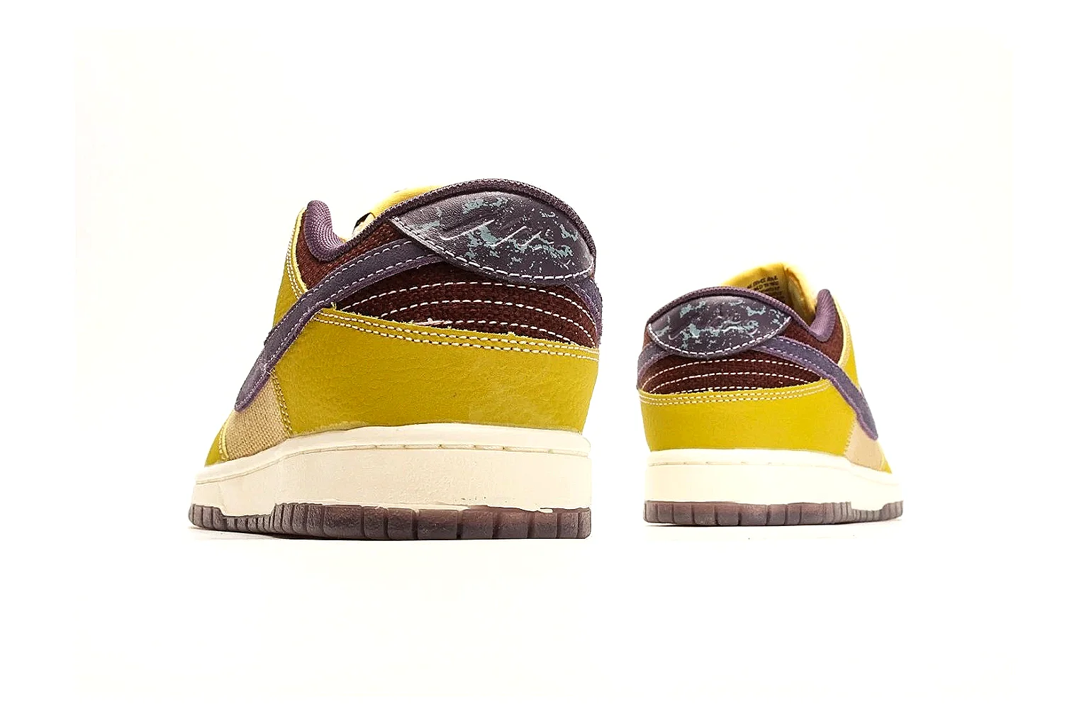 Nike Dunk Low Yellow Purple spreadsheet record photo showing yellow and purple leather panels, dark Swoosh, heel overlay, cream midsole, and brown outsole thumbnail 3