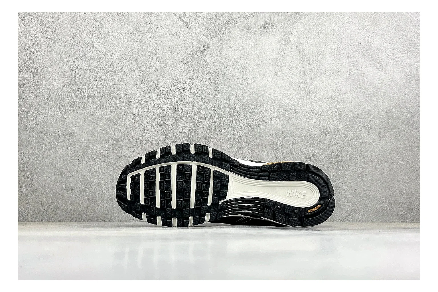 Nike P-6000 Black Orange spreadsheet record photo showing black layered runner upper, orange accent hits, retro P-6000 paneling, and cushioned casual sole