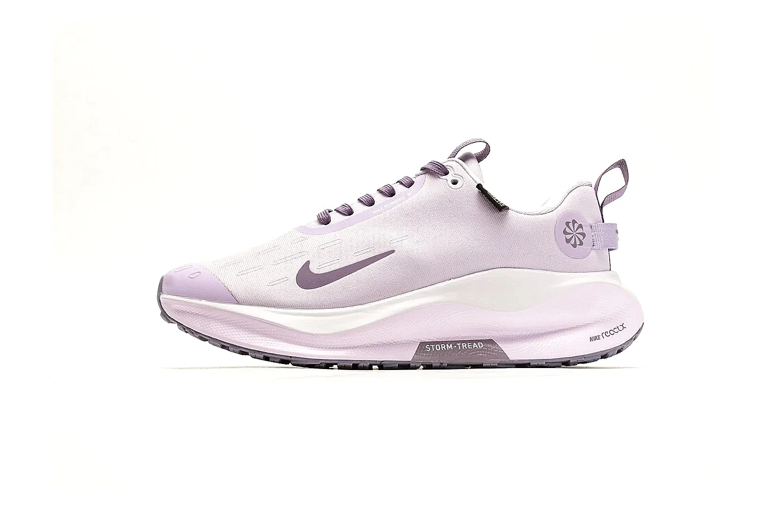 Nike ReactX GORE-TEX Lilac Sneakers spreadsheet record photo showing lilac textile upper, small Swoosh, heel pull tabs, cushioned ReactX-style sole, and weather-ready low profile