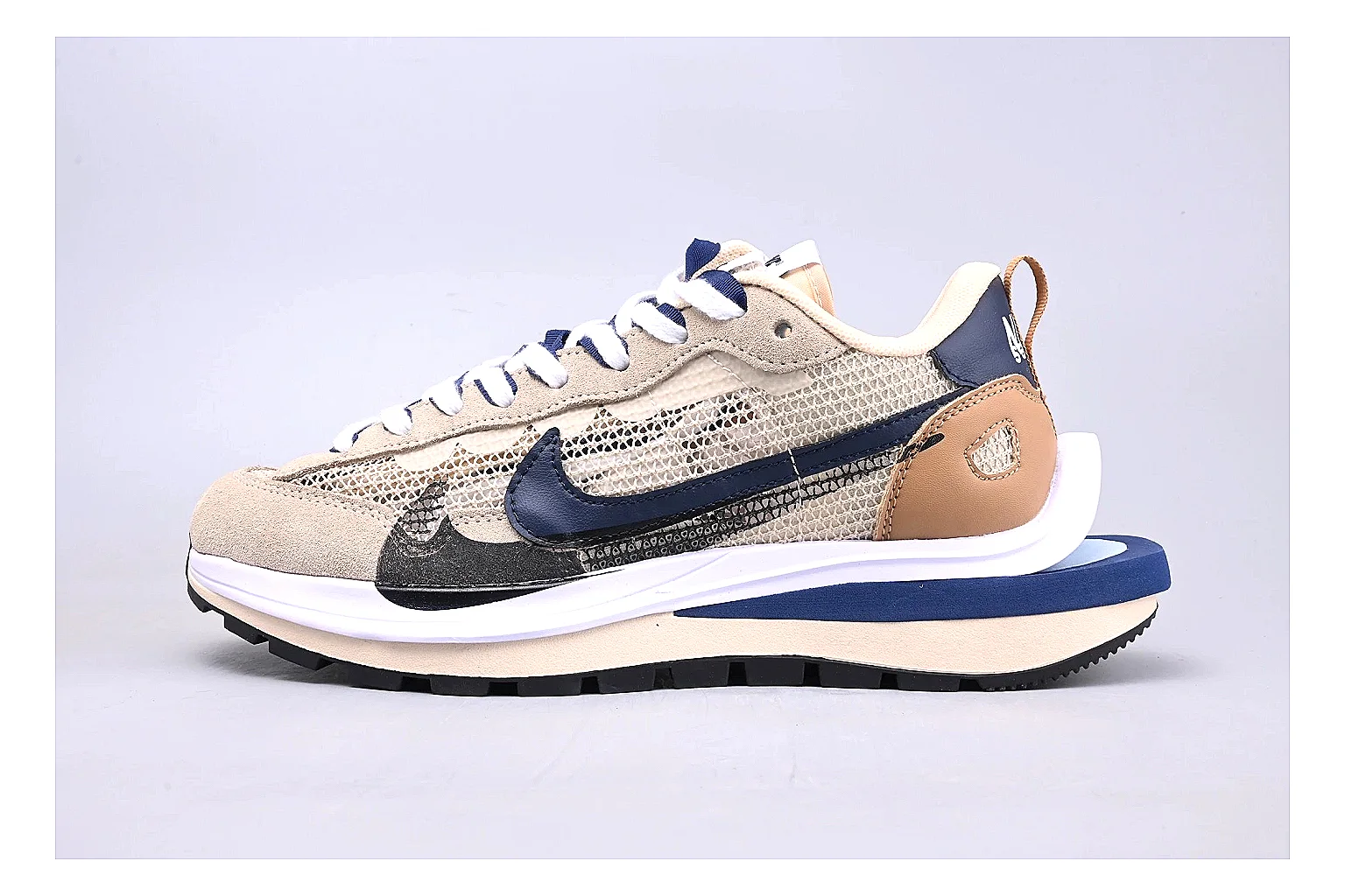 Nike Retro Runner Beige Blue spreadsheet record photo showing beige suede-mesh runner upper, blue accent panels, low retro profile, and cushioned running sole