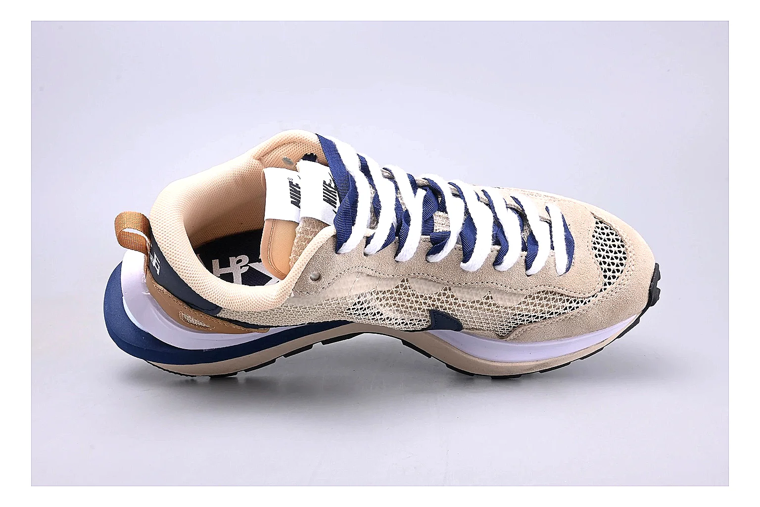 Nike Retro Runner Beige Blue spreadsheet record photo showing beige suede-mesh runner upper, blue accent panels, low retro profile, and cushioned running sole thumbnail 2