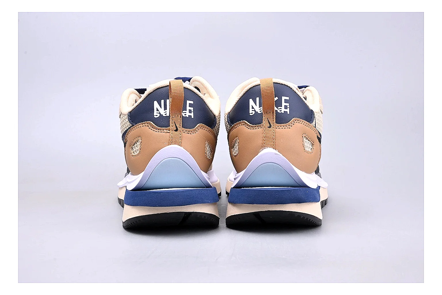 Nike Retro Runner Beige Blue spreadsheet record photo showing beige suede-mesh runner upper, blue accent panels, low retro profile, and cushioned running sole