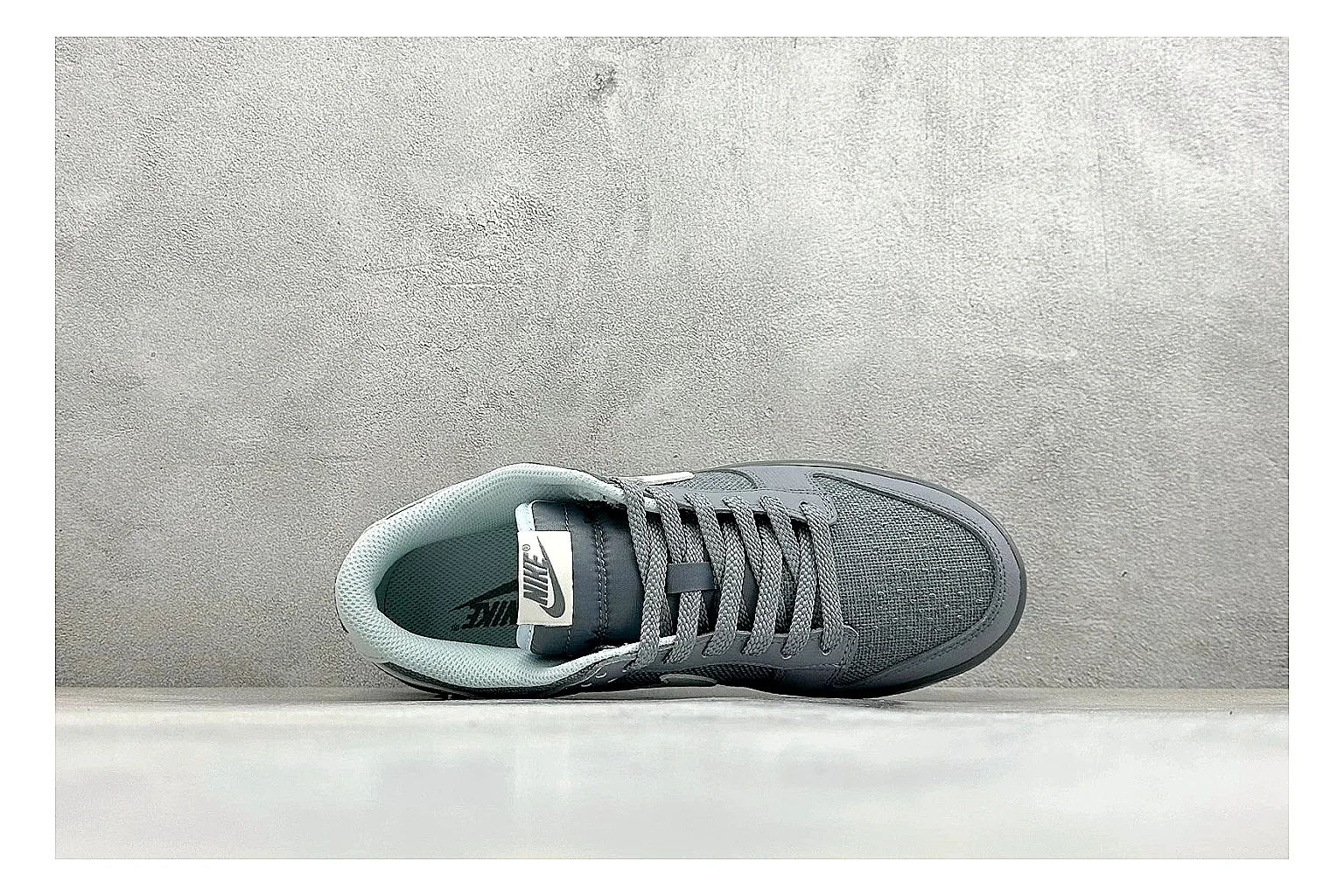 Nike SB Dunk Low Grey spreadsheet record photo showing grey low-top skate upper, white Swoosh, padded collar, and classic Dunk sole thumbnail 2