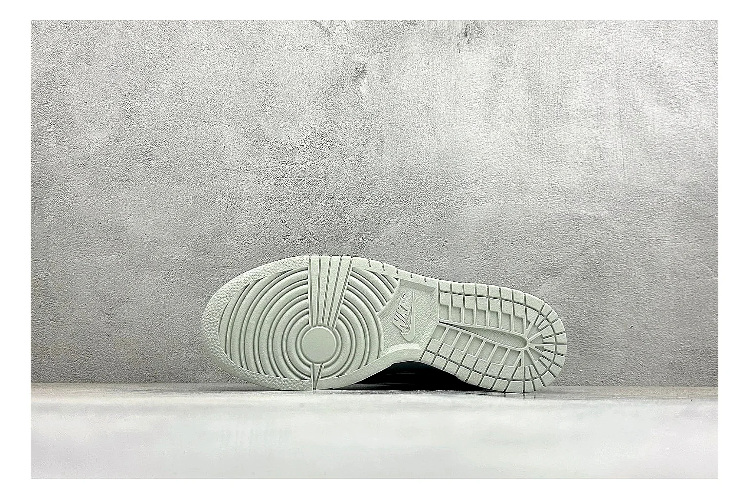 Nike SB Dunk Low Grey spreadsheet record photo showing grey low-top skate upper, white Swoosh, padded collar, and classic Dunk sole