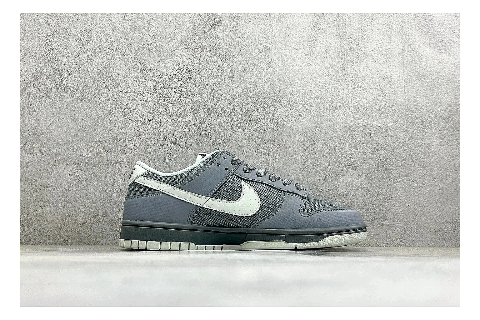 Nike SB Dunk Low Grey spreadsheet record photo showing grey low-top skate upper, white Swoosh, padded collar, and classic Dunk sole thumbnail 6