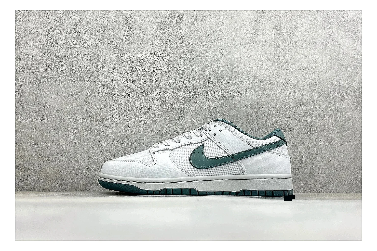 Nike SB Dunk Low White Green spreadsheet record photo showing white low-top skate upper, green Swoosh, padded collar, and classic Dunk sole shape