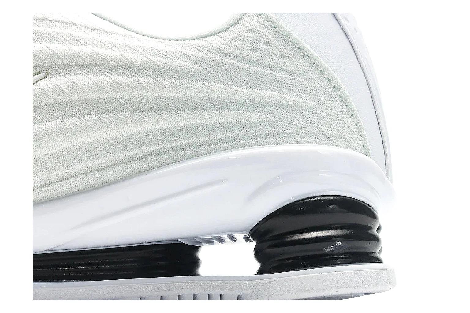 Nike Shox Z White Sneakers spreadsheet record photo showing white streamlined layered upper, small Swoosh, black heel cushioning columns, and modern low runner shape thumbnail 5