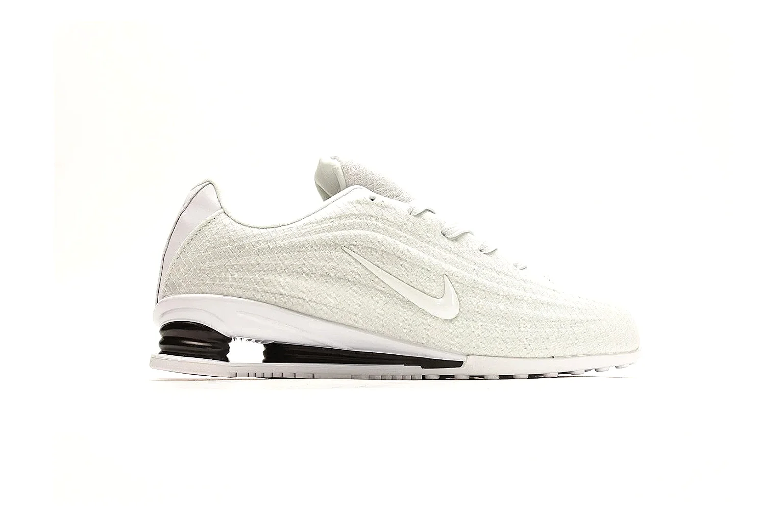 Nike Shox Z White Sneakers spreadsheet record photo showing white streamlined layered upper, small Swoosh, black heel cushioning columns, and modern low runner shape thumbnail 6