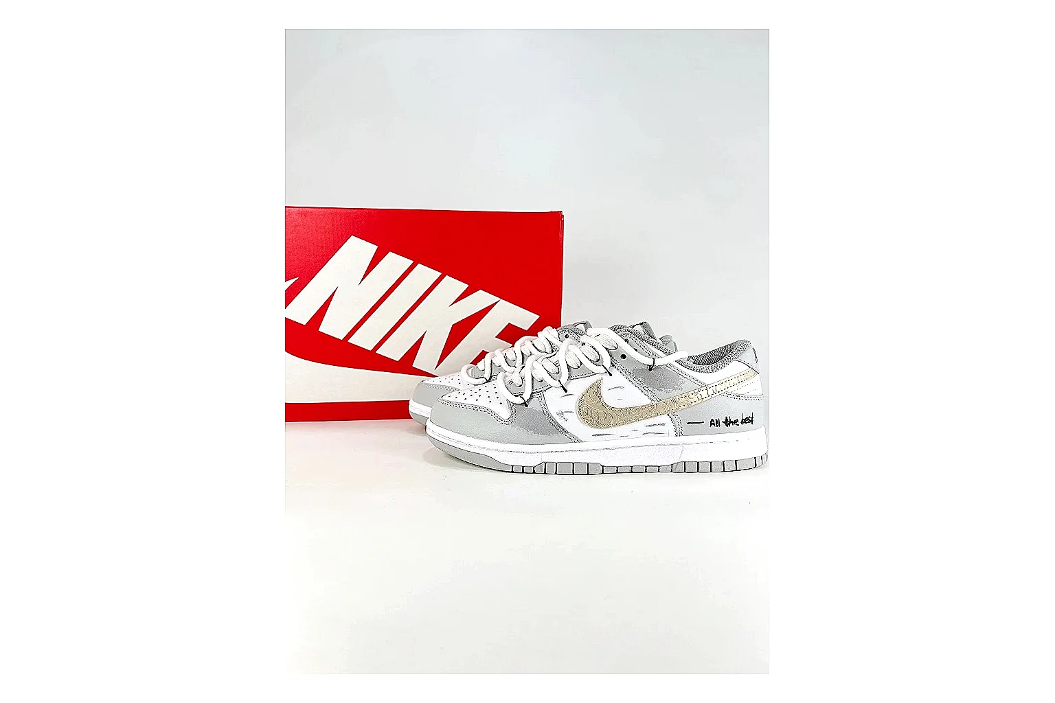Nike Silver Runner Silver Gold spreadsheet record photo showing silver synthetic-mesh upper, gold accent details, modern runner shape, and cushioned sole