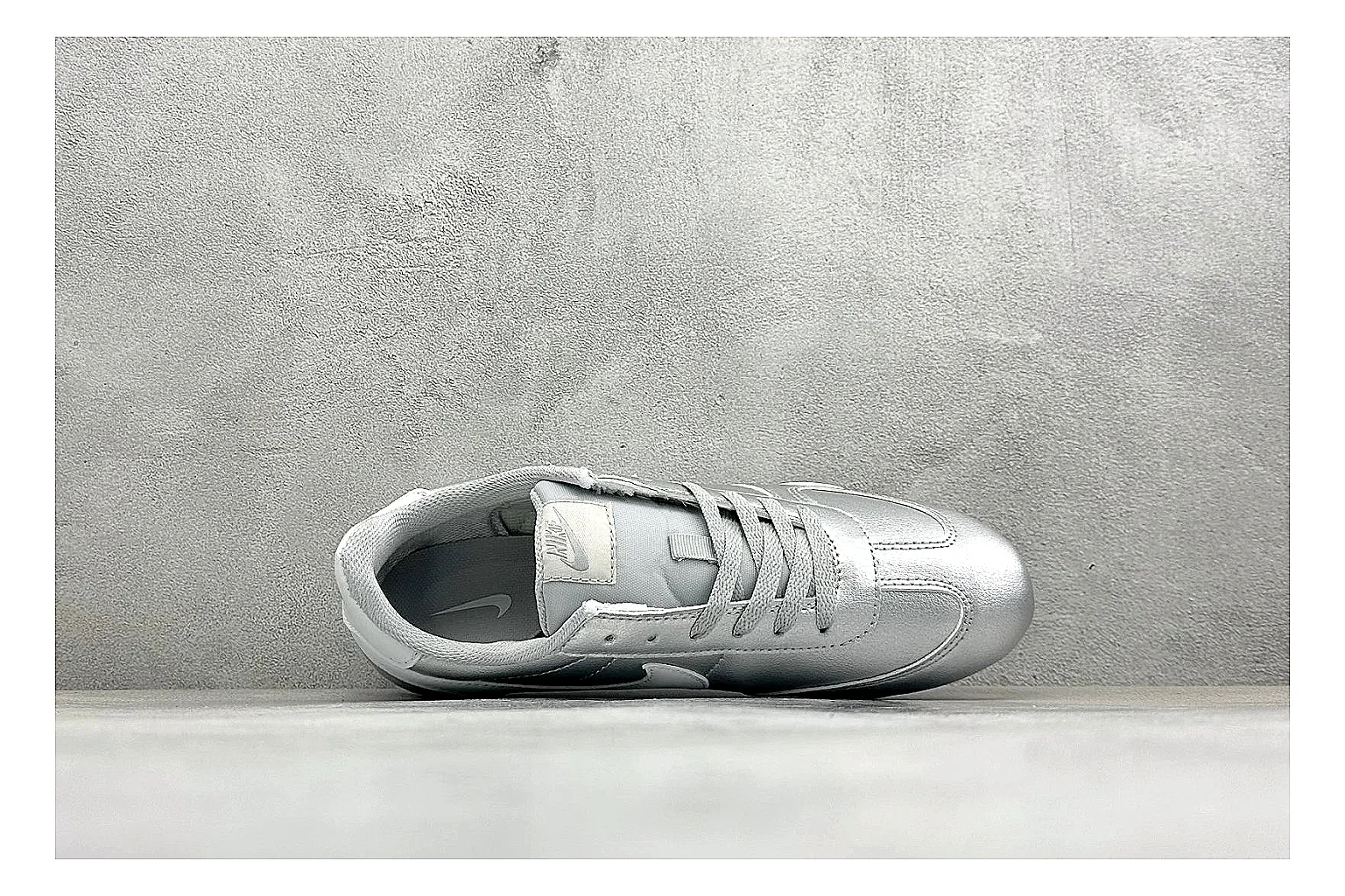 Nike Sprint Sister Silver spreadsheet record photo showing silver retro-runner upper, slim low-top shape, layered side panels, and a light everyday sole thumbnail 2