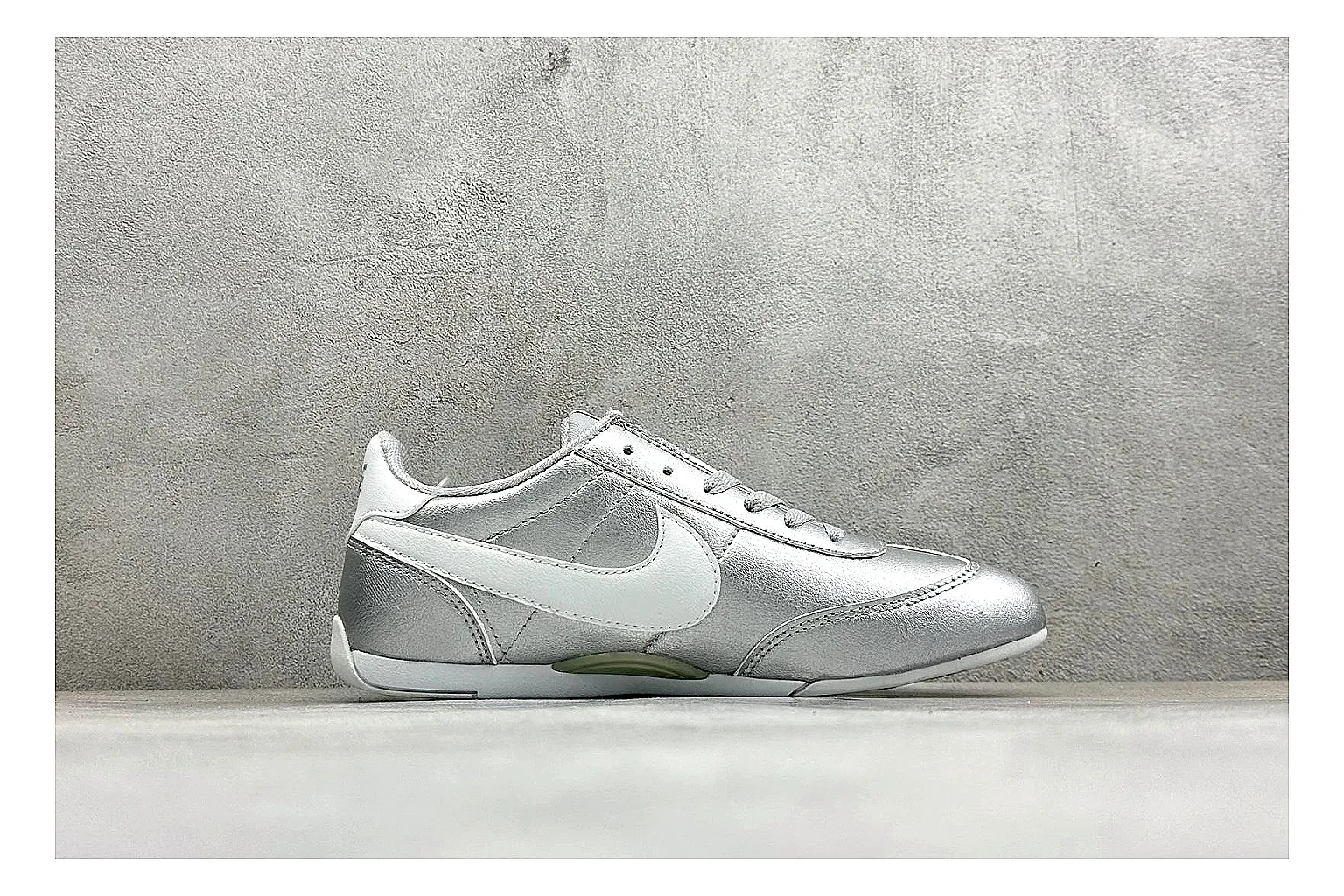 Nike Sprint Sister Silver spreadsheet record photo showing silver retro-runner upper, slim low-top shape, layered side panels, and a light everyday sole thumbnail 6